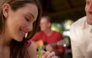 Woman with eyes looking down, being gazed upon by man
