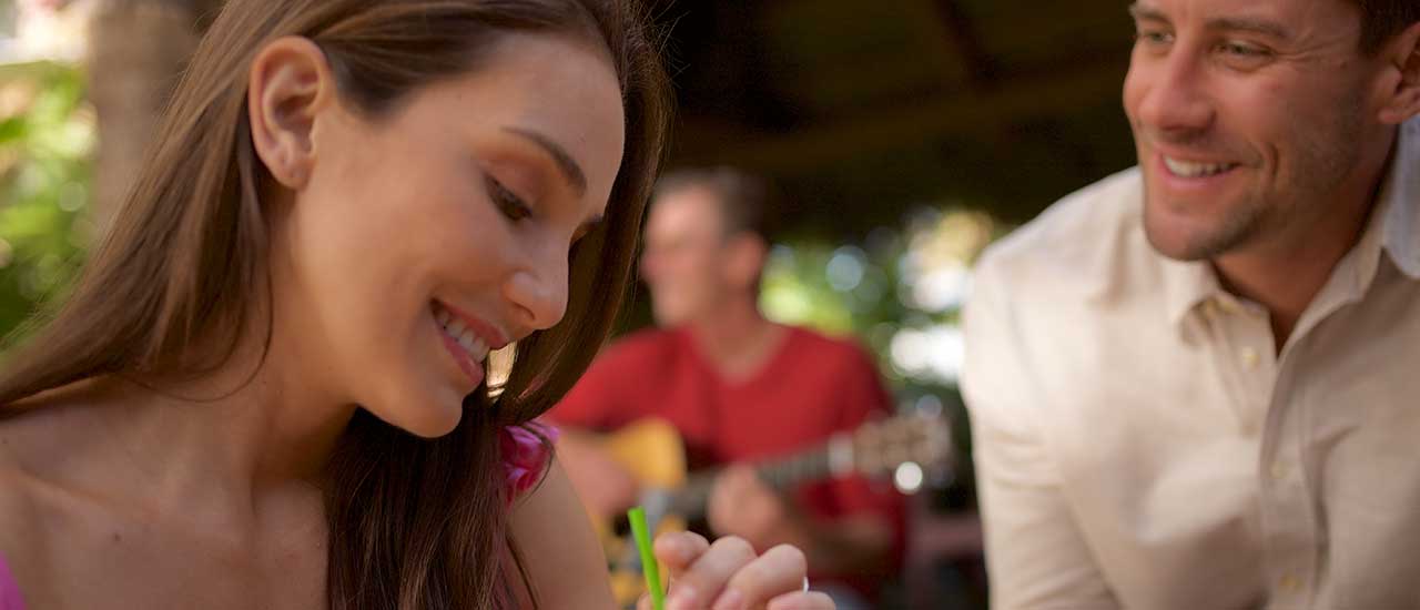 Woman with eyes looking down, being gazed upon by man